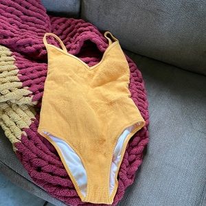 NBW Kendall and Kylie marigold one piece swimsuit.